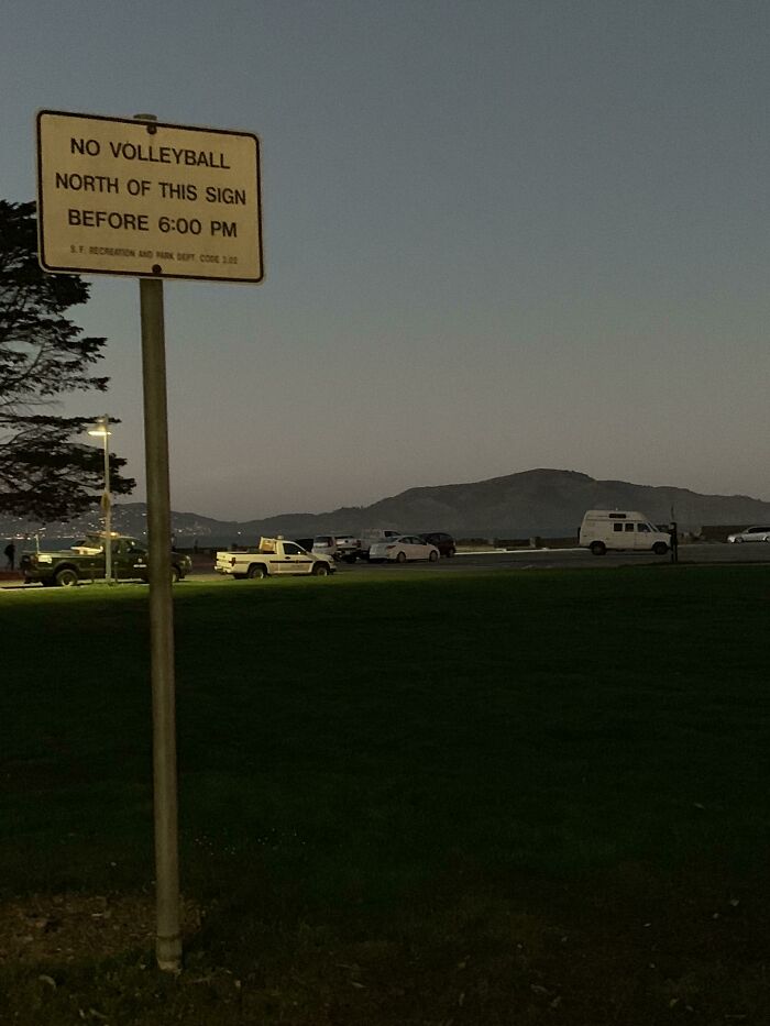 This Sign In An Open Field Near The Golden Gate Bridge