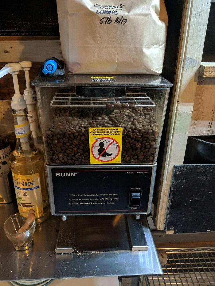 Weirdest Sticker On This Cafe's Coffee Grinder