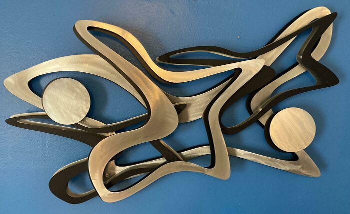 Metal wall art sculpture on the wall 