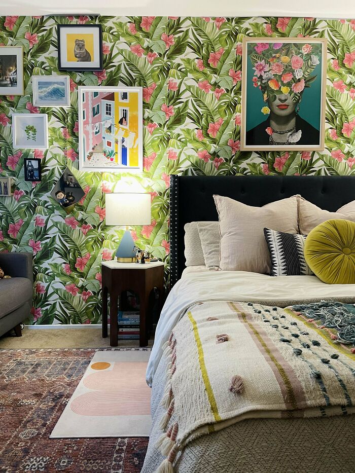 Photo of bedroom with green floral wallpaper