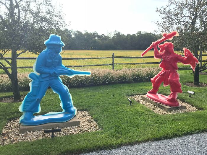 Statues Made To Look Like Native American And Cowboy Plastic Toys