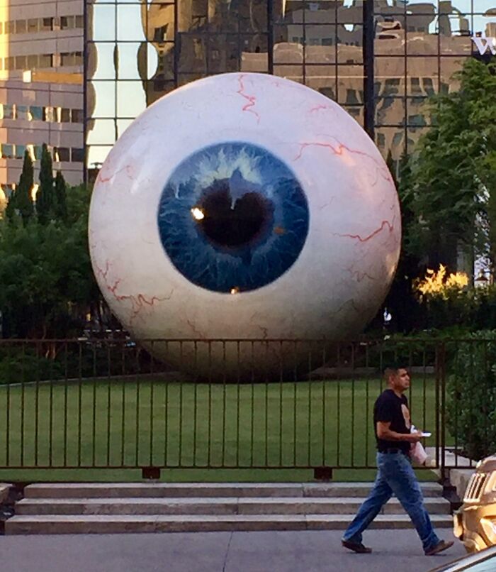 There's A Giant Statue Of An Eyeball Across The Street From The Restaurant I'm At