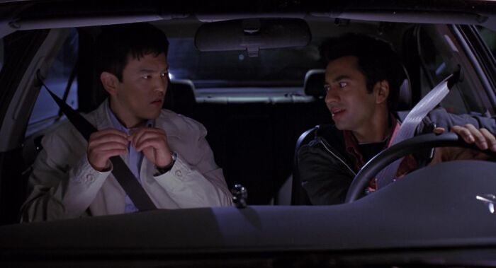 Two friends sitting in a car, having a conversation, highlighting iconic friendship duo dynamics.