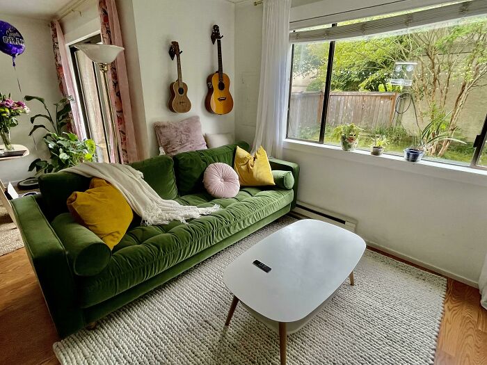 Photo of living room with green couch