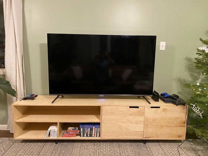 TV on wooden cabinet