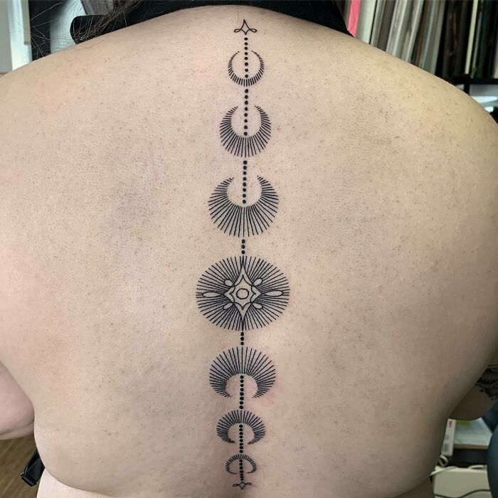 Black geometric spine tattoo
