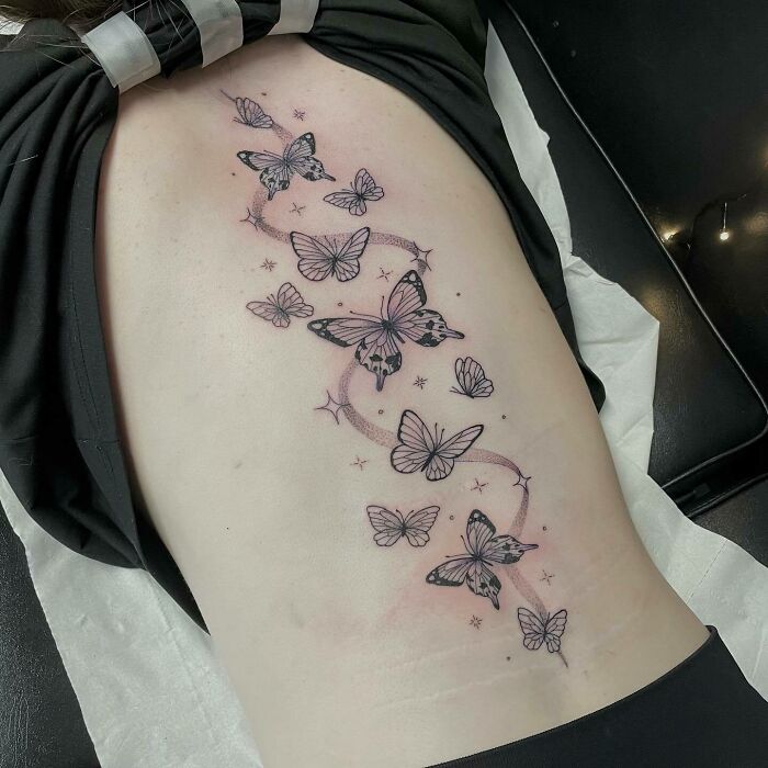 Butterflies spine tattoo 