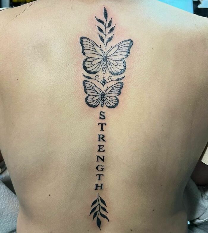 Two butterflies with "strength" inscription tattoo 
