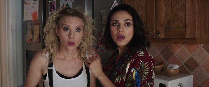 Two surprised women standing in a kitchen, highlighting iconic best friend duos in pop culture.