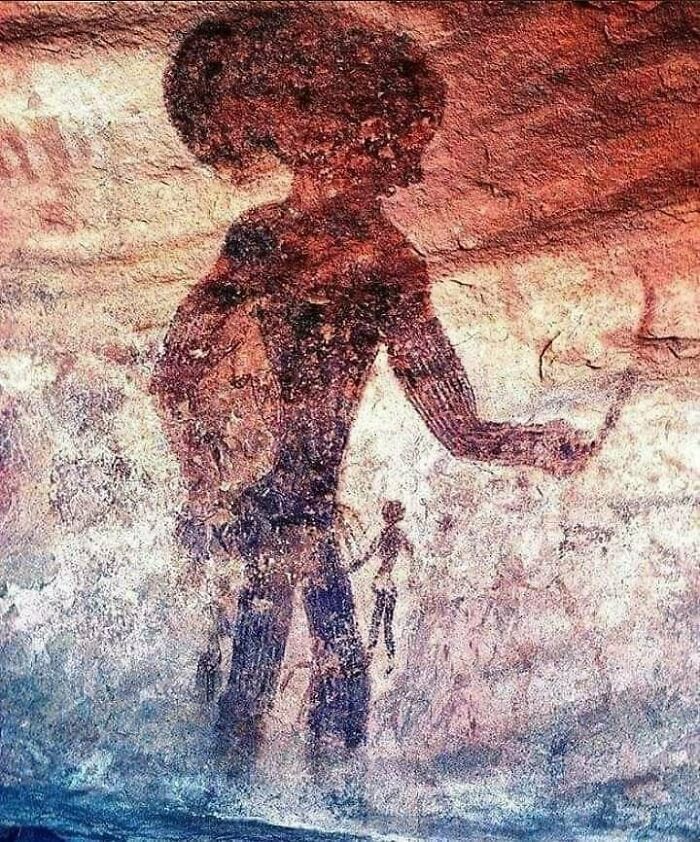 A Cave Painting From Tassili N'ajjer In Algeria, Showing A Giant Figure With A Big Head Next To A Small Figure, Dating To 6000 B.c. (720x866)