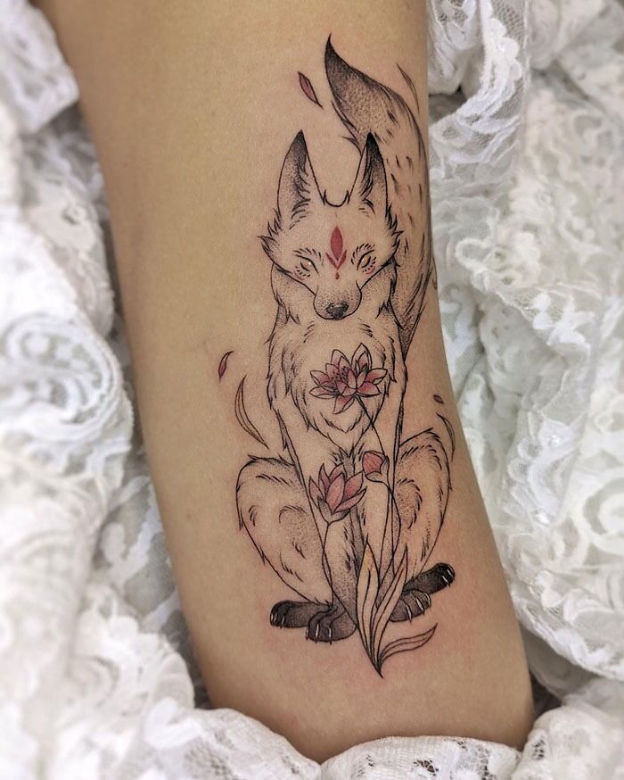 Fox tattoo design featuring flowers, perfect inspiration for your next animal tattoo.