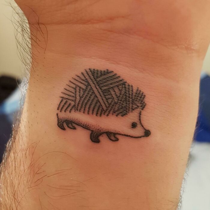 Small wrist hedgehog wrist tattoo