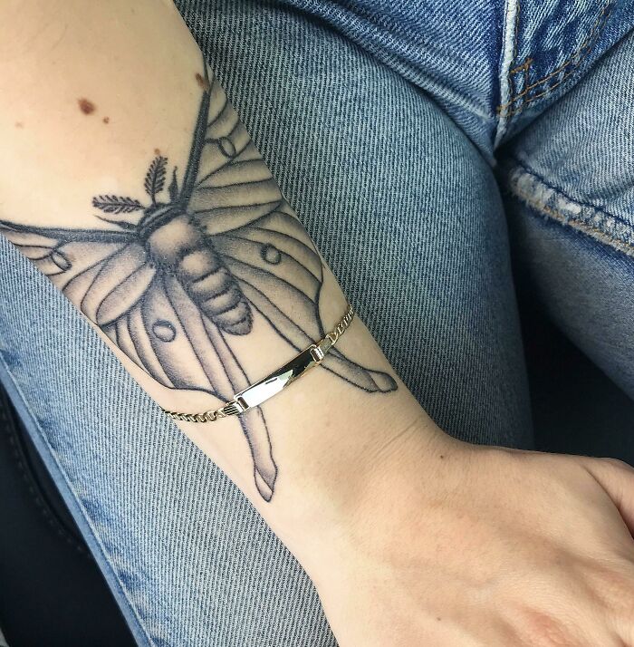 Luna moth wrist tattoo