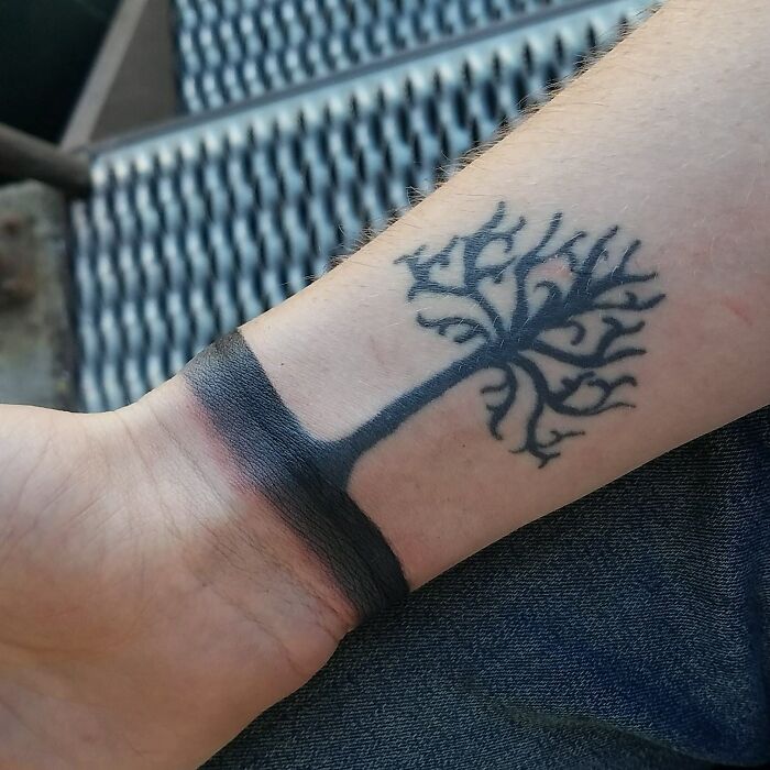 Wrist band with tree tattoo 
