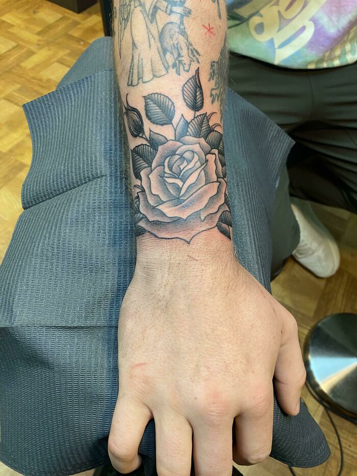 Rose tattoo on wrist