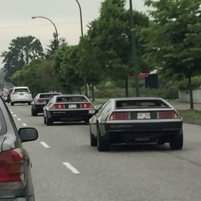 Three Deloreans Driving In A Row