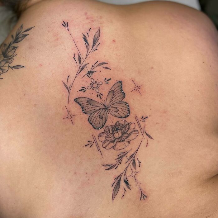 Butterfly and flowers back tattoo
