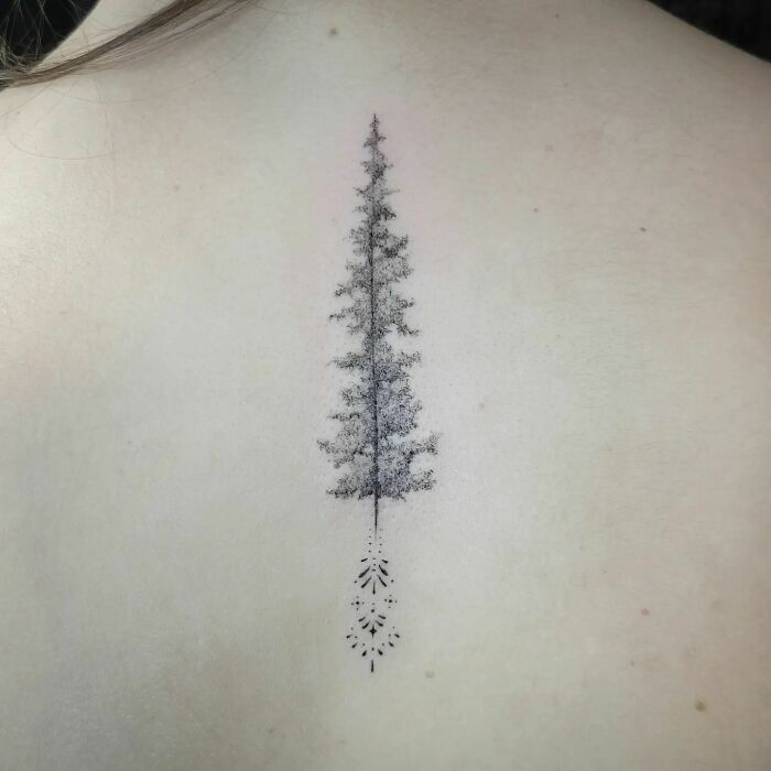 Black pinetree tattoo on back