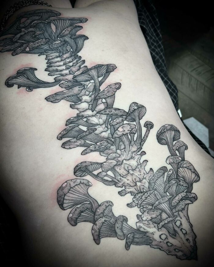Column of mushrooms spine tattoo