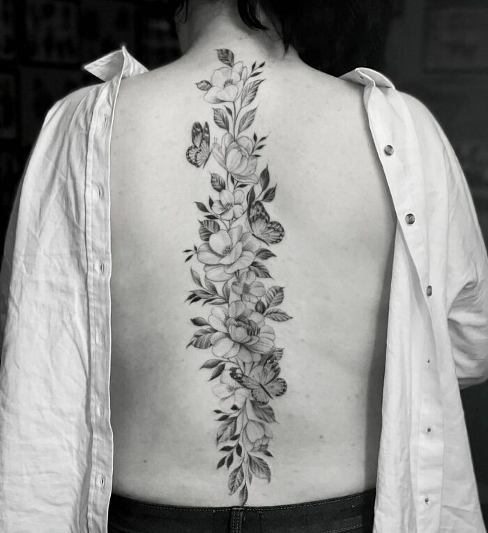 Flowers and butterflies back tattoo 