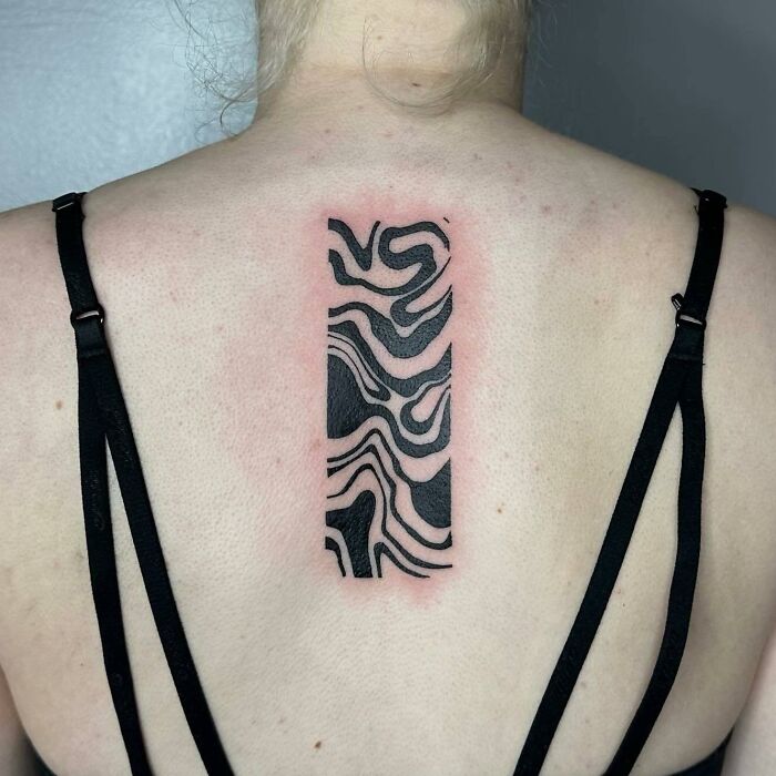 Black abstract flow rectangle tattoo on back