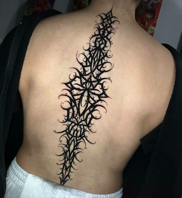 Dark Geometrical Art Spine Tattoo