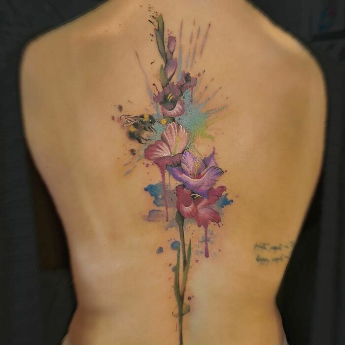 Gladiolus flowers with colourful splashes tattoo 