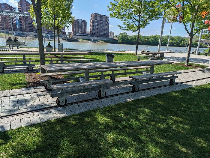 These Picnic Benches Are Mounted On Old Streetcar Tracks So They Can Roll Together Or Apart