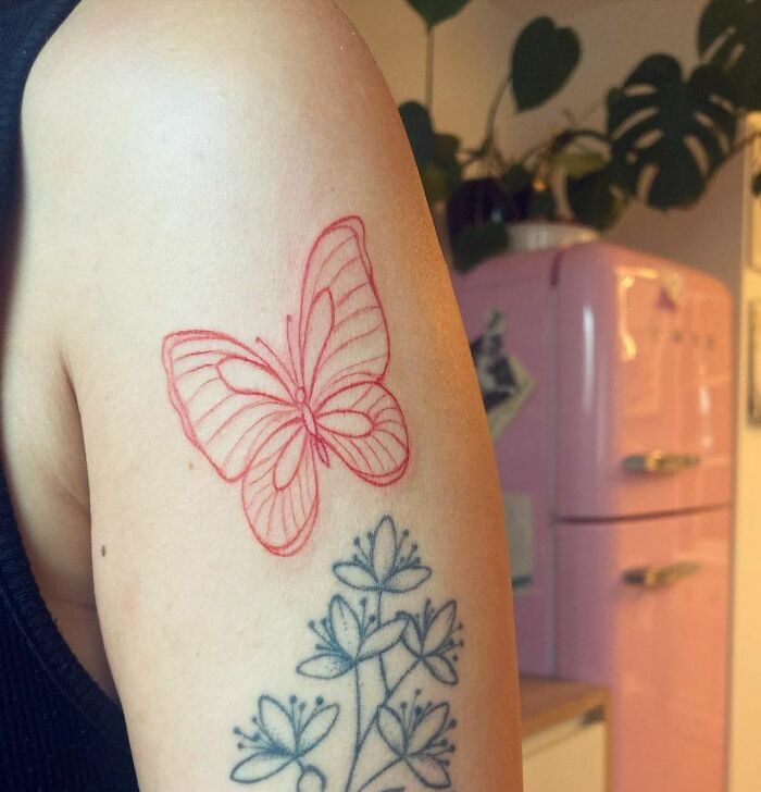 Red butterfly and black flower tattoo 