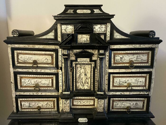 Big Antique German Chest. Apparently It’s Been In My Family For Generations. Made From Dark Black Wood And Ivory. The Panels Are Etched And Decorated. Inside Are Numerous Drawers. The Chest Contains A Bunch Of Very Old Books, The Oldest From The 1690s. What Is This Thing?