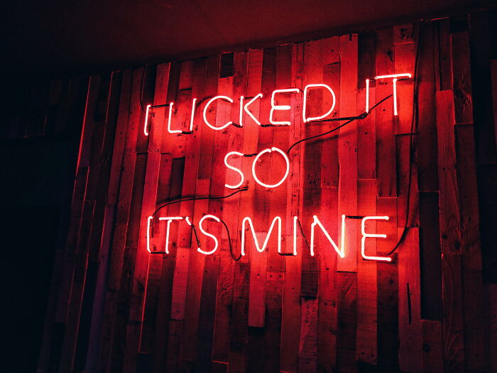 "I licked it so it's mine" neon sign 