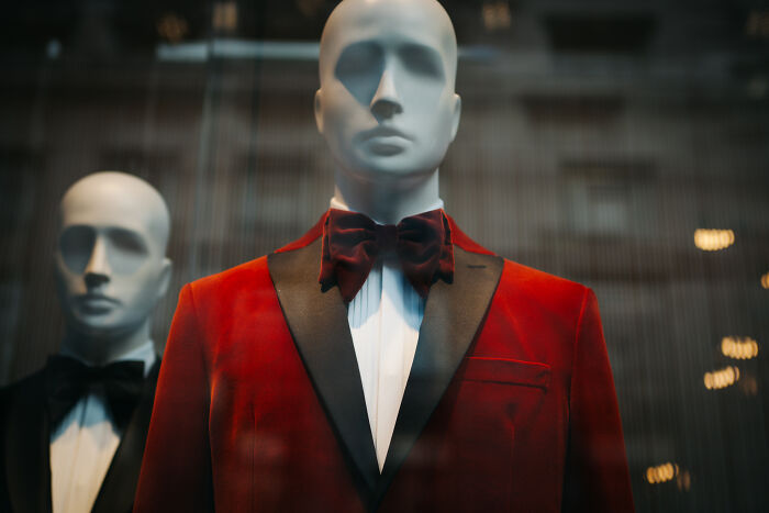 A mannequin wearing a red tuxedo