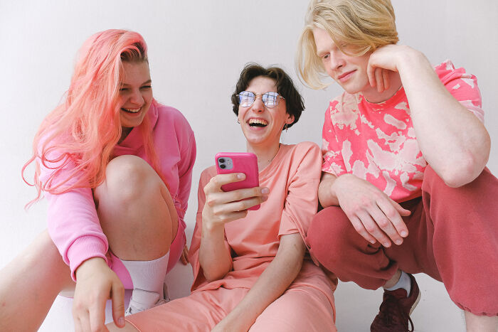 People wearing pink and laughing 