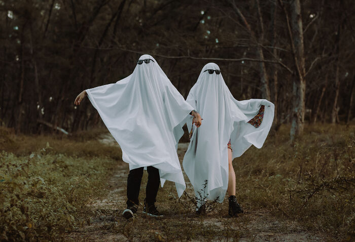 People wearing white shits pretending to be a ghost 