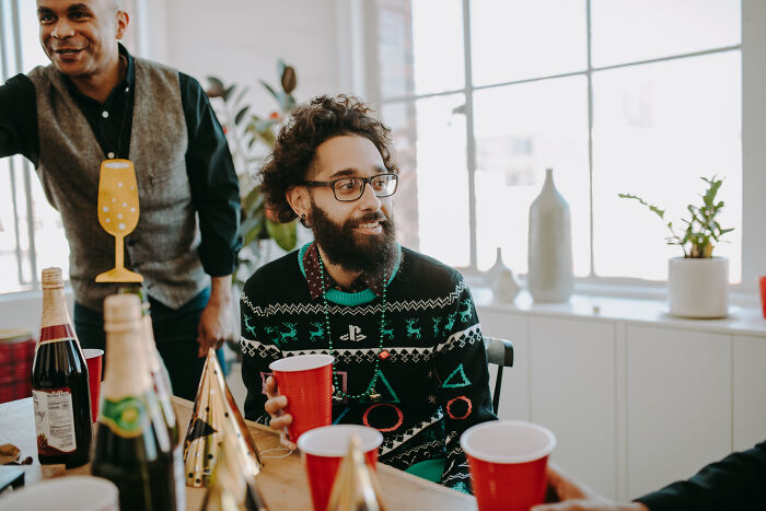 A man wearing Christmas sweater 