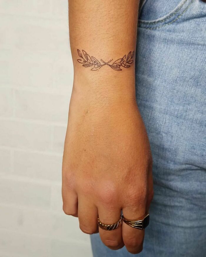 Olive branch wrist tattoo