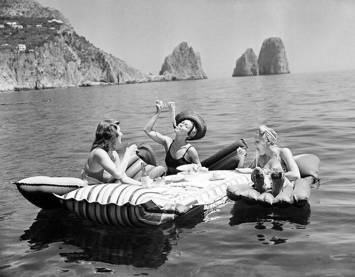 Three Young Women Eat Spaghetti On Floaties, Capri, Italy, 1939