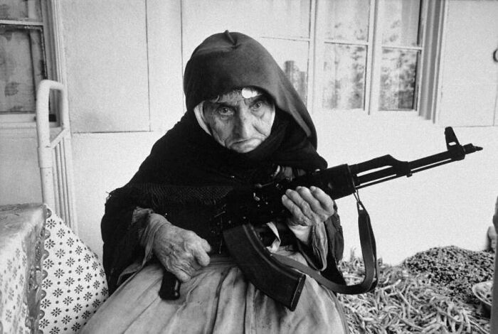106-Year-Old Armenian Woman Sits In Front Of Her Home Guarding It With A Rifle, 1990