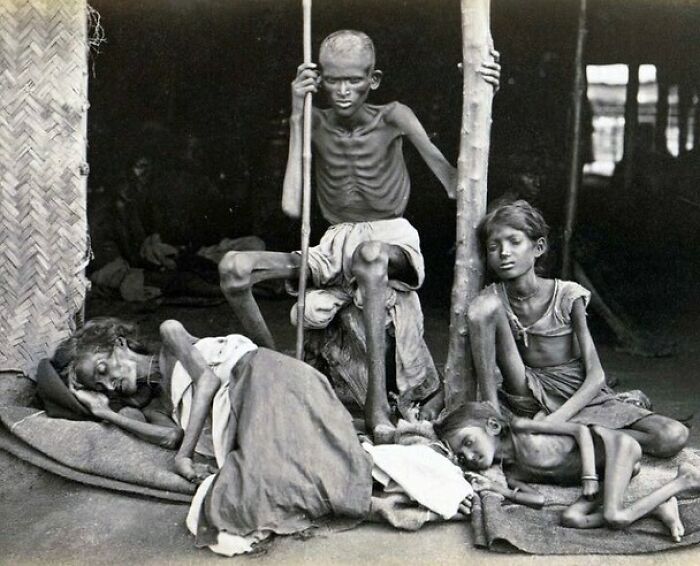 A Man Guards His Family From Cannibals During The Madras Famine In India, 1877
