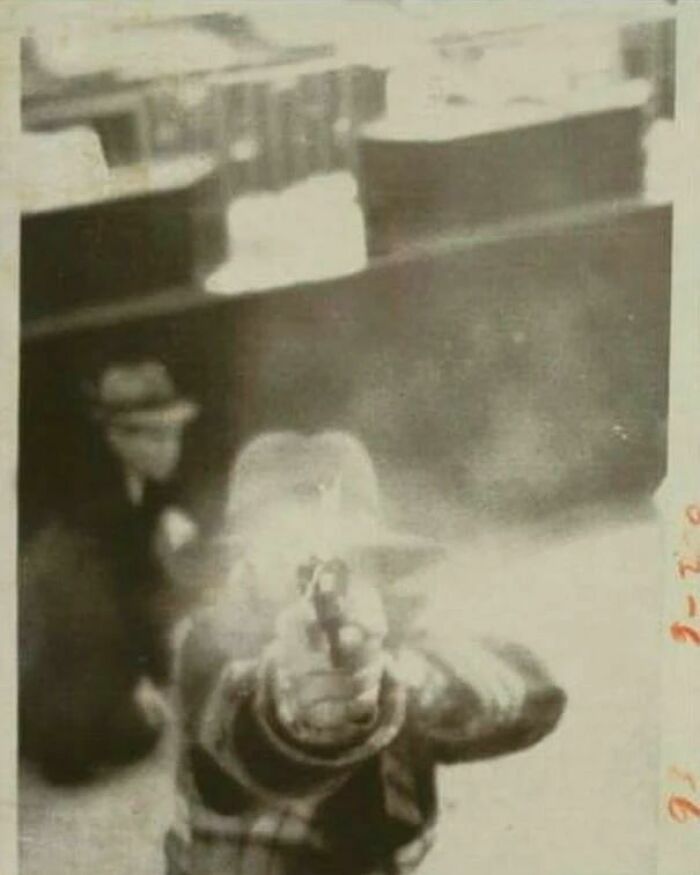 A Bank Robber Shooting His Pistol At The Surveillance Camera, Cleveland, Ohio, 1977