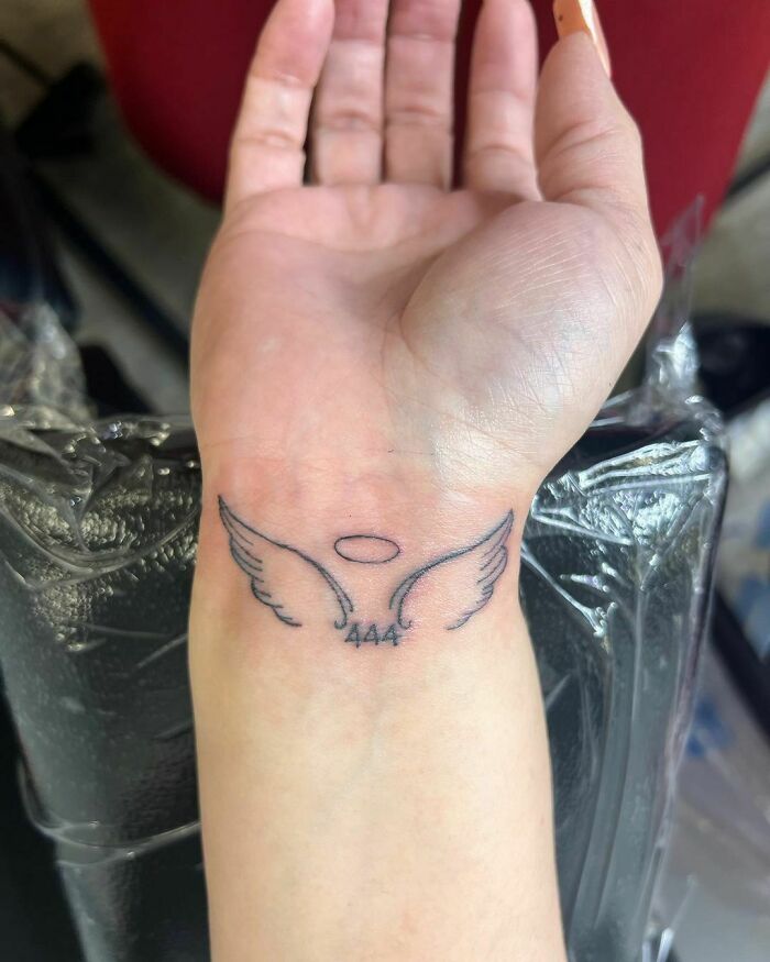 Angel wings 444 tattoo on wrist