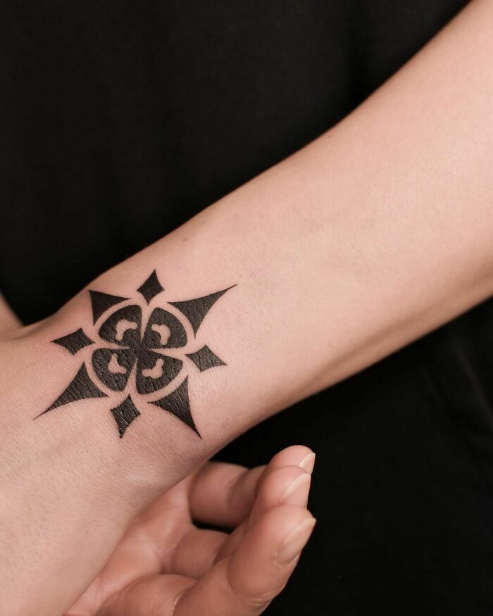 Wrist ornament tattoo