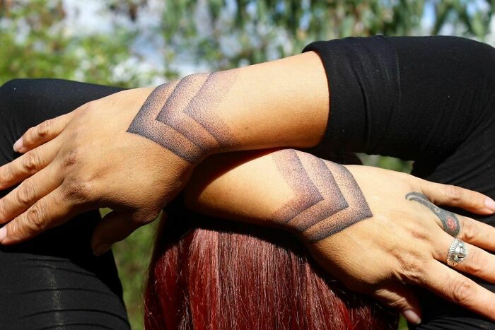 Tribal cuffs wrist tattoo