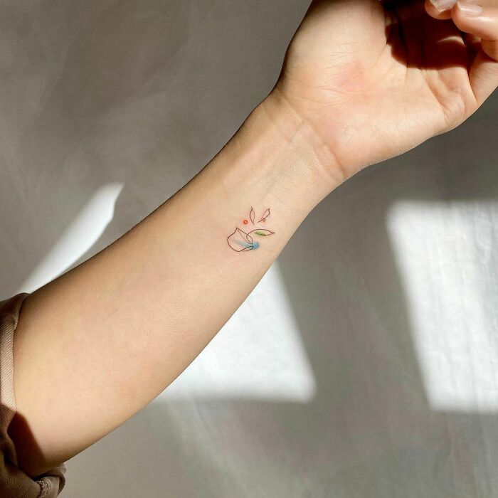 Small cup of tea tattoo on the wrist