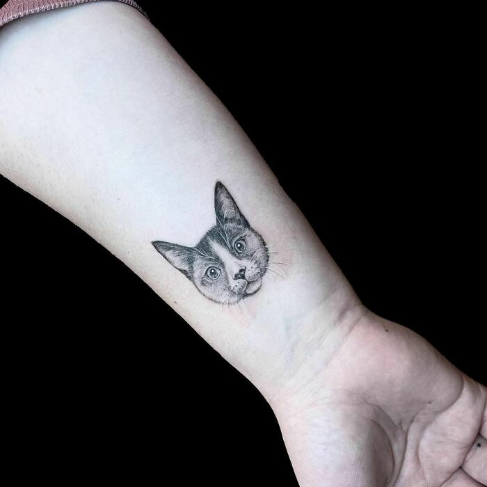 Cat wrist tattoo