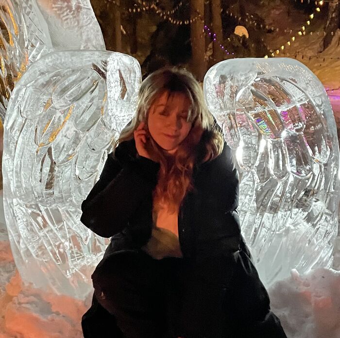 Me Trying To Be Funny In Front Of Some Ice-Carved Angel Wings Lol