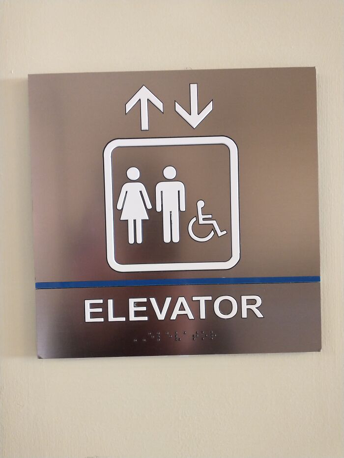 The Elevator Was To The Left, And The Bathroom To The Right. They Also Had Tis Sign Referring To Both