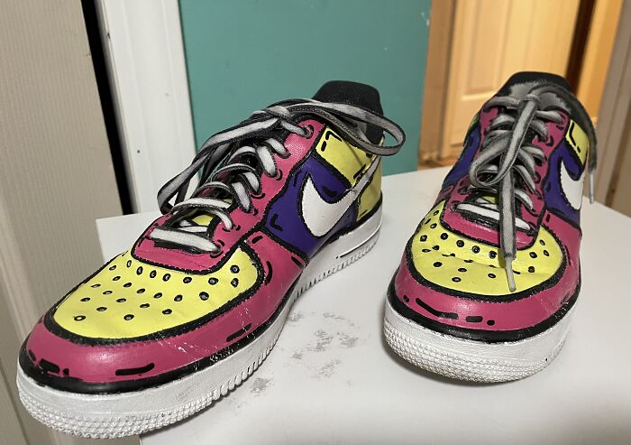 Cartoon-themed sneakers showcasing a unique and colorful design, featuring bold pink, yellow, and purple accents.