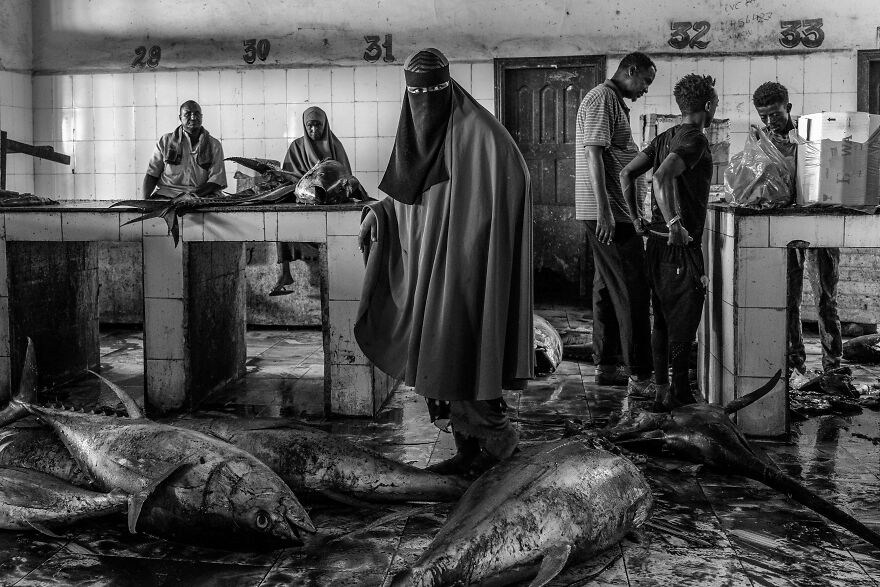 Woman In Fish Market From The Series 'Inside Hamar Weyne Fish Market In The Heart Of Mogadishu, Somalia' By Tariq Zaidi