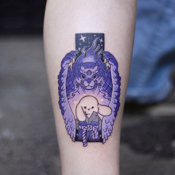 Adorable animal-themed tattoo featuring a bunny with mystical elements on a person's forearm.